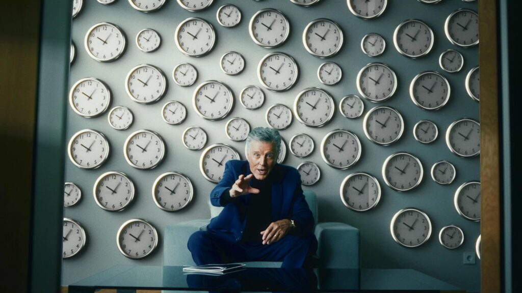 Shot of a commercial, a actor, in a blue suit made by atelier DREISIEBEN