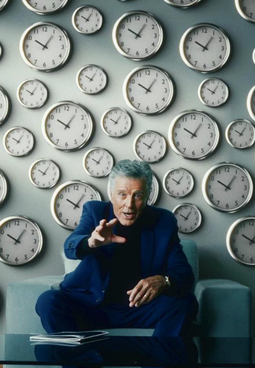 Shot of a commercial, a actor, in a blue suit made by atelier DREISIEBEN